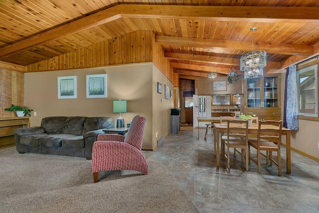 148 21st Ave N, Saint Cloud, MN 56303 - living room with a chandelier, stone finish flooring, baseboards, and wood ceiling