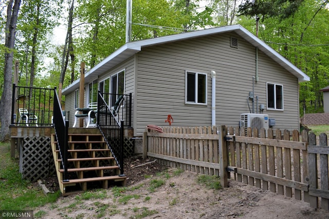 48080 218th Pl, Mcgregor, MN 55760 - view of home's exterior featuring stairway, a deck, and ac unit