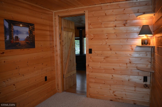 48080 218th Pl, Mcgregor, MN 55760 - hallway with wood ceiling, wood walls, and carpet floors
