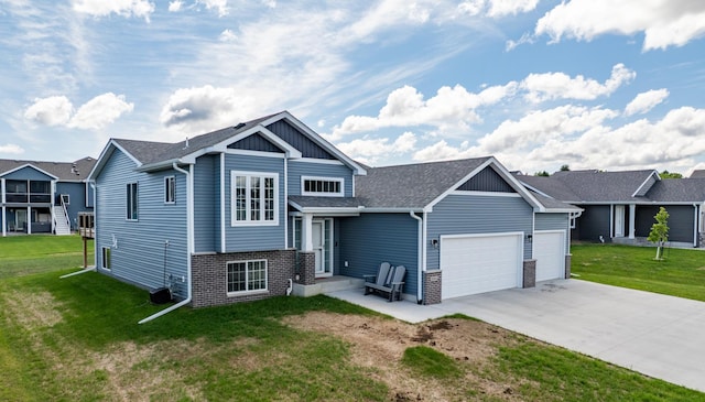 1004 7th Ave NW, Kasson, MN 55944 - view of front of home featuring a garage, driveway, a front lawn, and brick siding