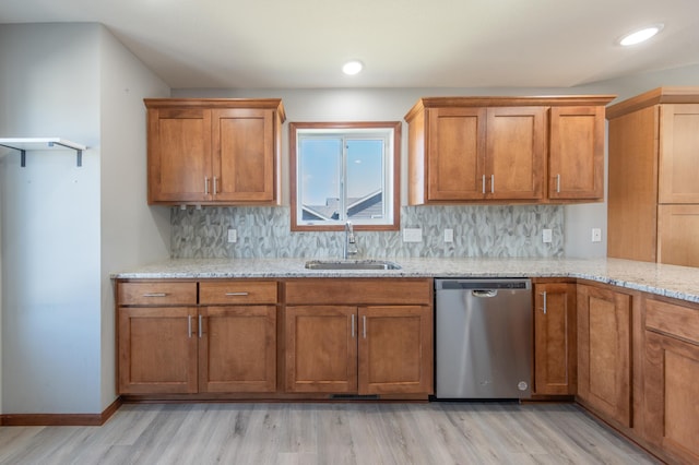 1004 7th Ave NW, Kasson, MN 55944 - kitchen with stainless steel dishwasher, a sink, light wood-type flooring, brown cabinets, and recessed lighting