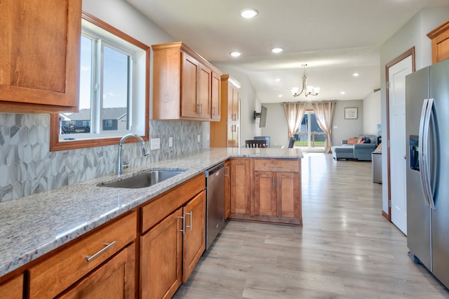 1004 7th Ave NW, Kasson, MN 55944 - kitchen with stainless steel appliances, a sink, a chandelier, light wood-style floors, and recessed lighting