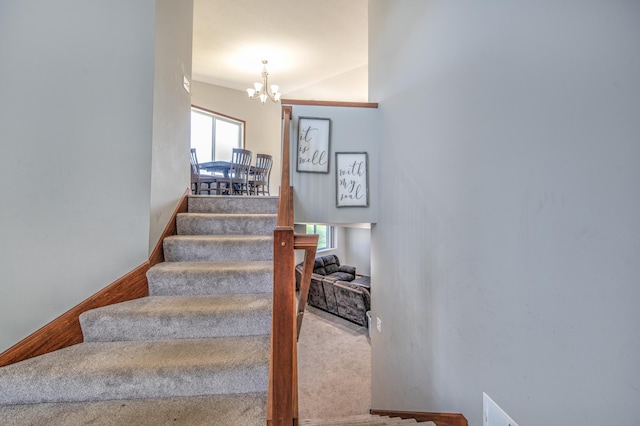 1004 7th Ave NW, Kasson, MN 55944 - stairs with a chandelier and carpet floors
