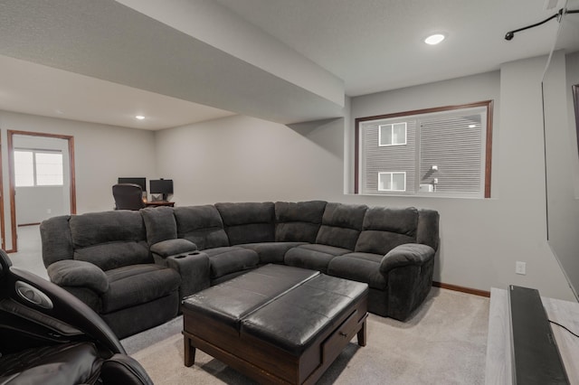 1004 7th Ave NW, Kasson, MN 55944 - living room featuring light carpet, recessed lighting, baseboards, and a desk