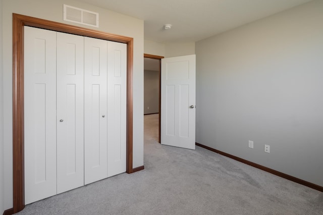 1004 7th Ave NW, Kasson, MN 55944 - unfurnished bedroom featuring carpet floors, baseboards, and a closet