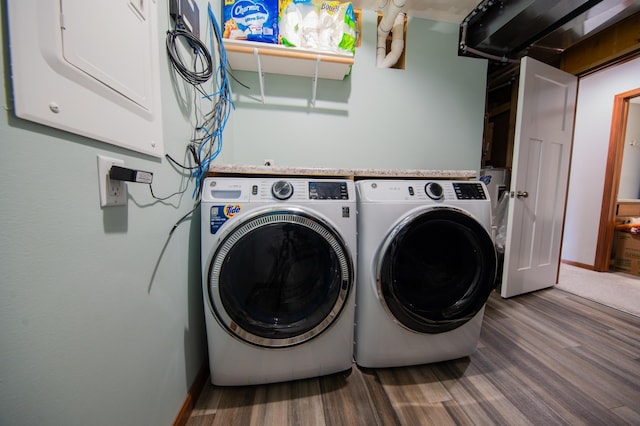 1004 7th Ave NW, Kasson, MN 55944 - laundry area with washer and dryer, wood finished floors, and baseboards
