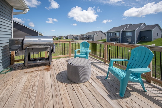 1004 7th Ave NW, Kasson, MN 55944 - wooden terrace with a residential view and a lawn