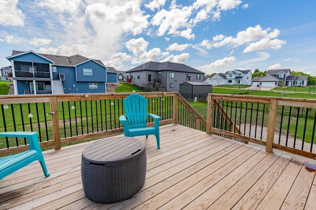 1004 7th Ave NW, Kasson, MN 55944 - wooden deck featuring a residential view, a sunroom, stairway, and a yard