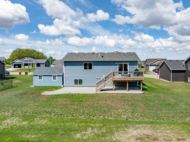1004 7th Ave NW, Kasson, MN 55944 - back of property featuring a deck, a residential view, a lawn, a shingled roof, and an outdoor structure