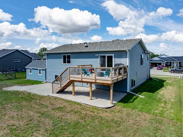1004 7th Ave NW, Kasson, MN 55944 - rear view of house with a wooden deck, a shingled roof, a yard, and stairs