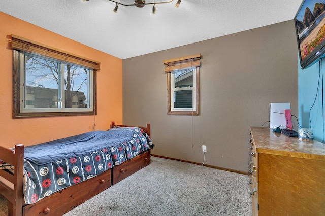 1410 12th Ave N, Saint Cloud, MN 56303 - carpeted bedroom featuring baseboards and a textured ceiling