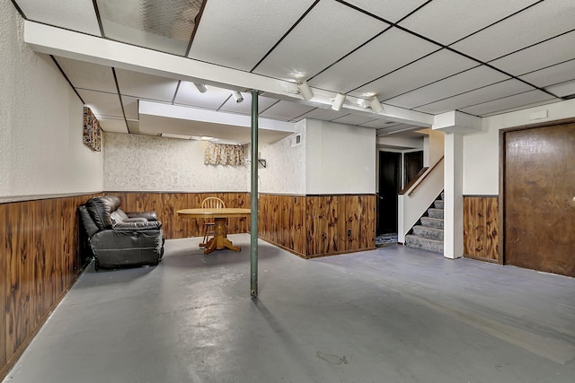 1410 12th Ave N, Saint Cloud, MN 56303 - finished basement with wainscoting, wooden walls, and stairs