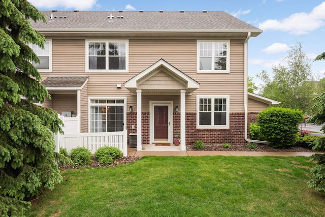 20338 Kensfield Trl Unit 1606, Lakeville, MN 55044 - view of front of home featuring a front lawn, brick siding, and a shingled roof
