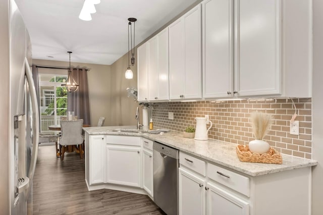 20338 Kensfield Trl Unit 1606, Lakeville, MN 55044 - kitchen with stainless steel appliances, white cabinetry, a peninsula, dark wood finished floors, and tasteful backsplash