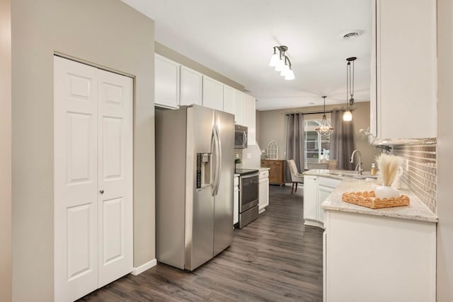 20338 Kensfield Trl Unit 1606, Lakeville, MN 55044 - kitchen with appliances with stainless steel finishes, a sink, white cabinets, dark wood-style flooring, and decorative backsplash