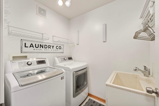 20338 Kensfield Trl Unit 1606, Lakeville, MN 55044 - laundry room featuring washer and dryer and baseboards