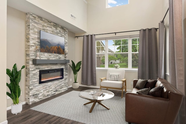 20338 Kensfield Trl Unit 1606, Lakeville, MN 55044 - living room featuring a fireplace, dark wood-type flooring, baseboards, and a high ceiling