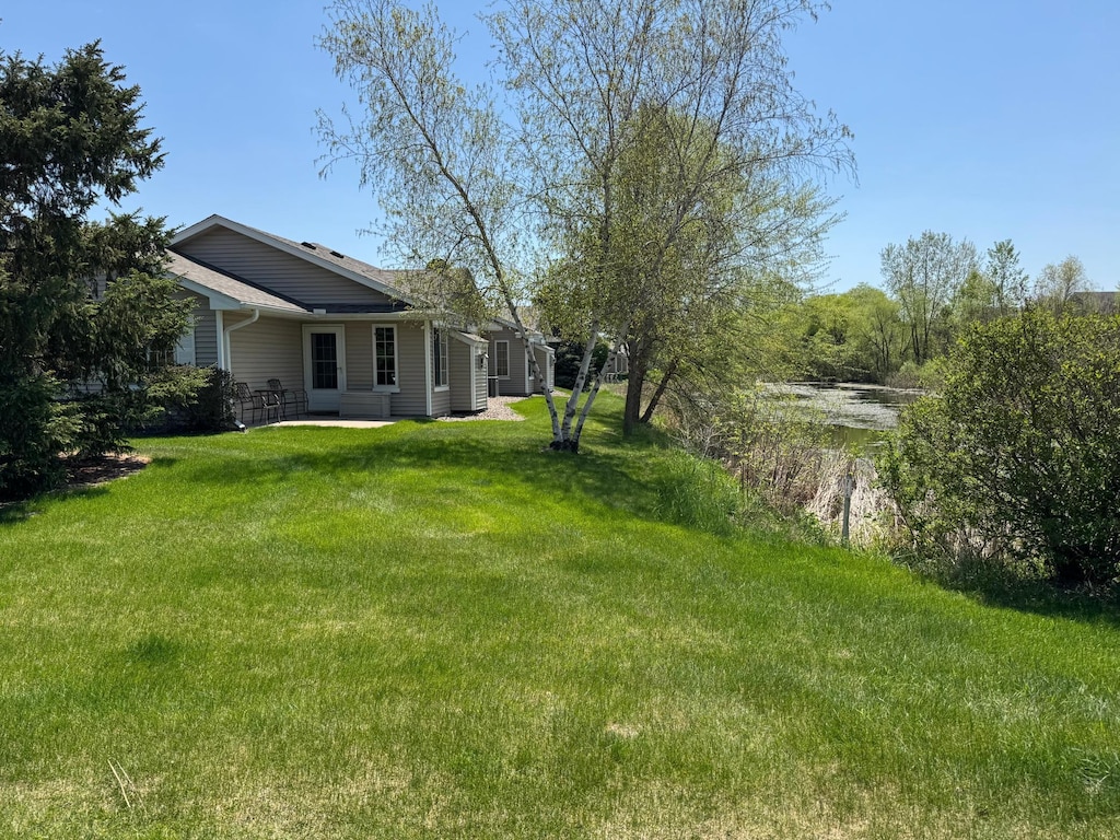 6101 150th St N, Hugo, MN 55038 - view of grassy yard featuring a patio