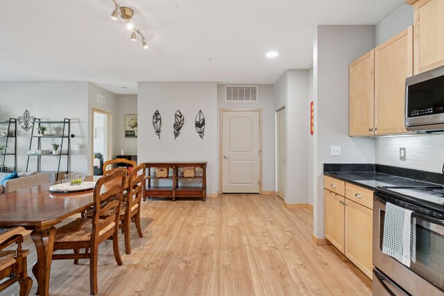 4132 Vernon Ave S Unit A103, Saint Louis Park, MN 55416 - dining room featuring light wood-type flooring and baseboards