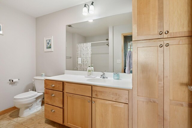 4132 Vernon Ave S Unit A103, Saint Louis Park, MN 55416 - full bath with toilet, vanity, tile patterned flooring, and curtained shower