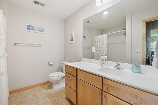 4132 Vernon Ave S Unit A103, Saint Louis Park, MN 55416 - bathroom with toilet, vanity, baseboards, tile patterned floors, and curtained shower