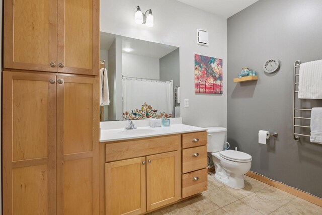 4132 Vernon Ave S Unit A103, Saint Louis Park, MN 55416 - bathroom featuring vanity, toilet, tile patterned flooring, and curtained shower