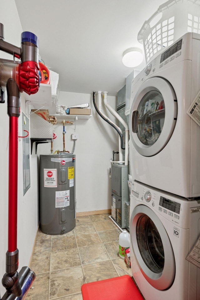 4132 Vernon Ave S Unit A103, Saint Louis Park, MN 55416 - laundry room featuring water heater, stacked washer / drying machine, baseboards, and stone finish floors