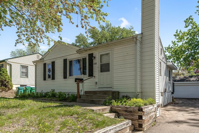 3311 Yukon Ave S, Saint Louis Park, MN 55426 - view of front facade with entry steps and a chimney