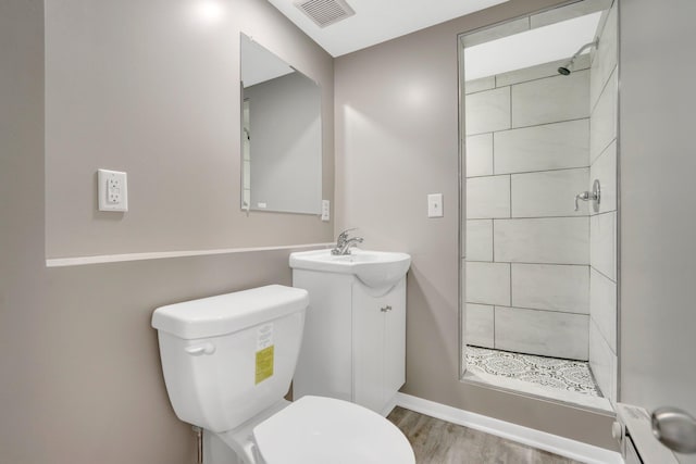 3311 Yukon Ave S, Saint Louis Park, MN 55426 - bathroom featuring a shower stall, toilet, vanity, and wood finished floors