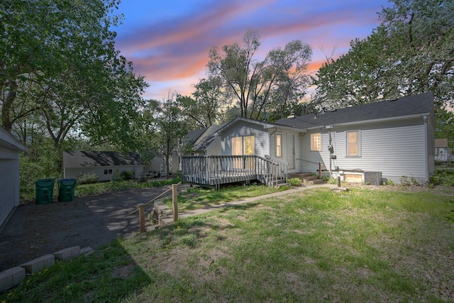 3311 Yukon Ave S, Saint Louis Park, MN 55426 - back of house featuring a deck, central air condition unit, and a yard