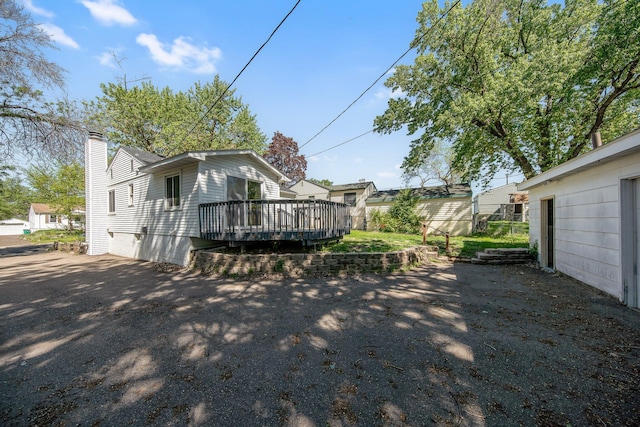 3311 Yukon Ave S, Saint Louis Park, MN 55426 - back of house with a wooden deck and a chimney