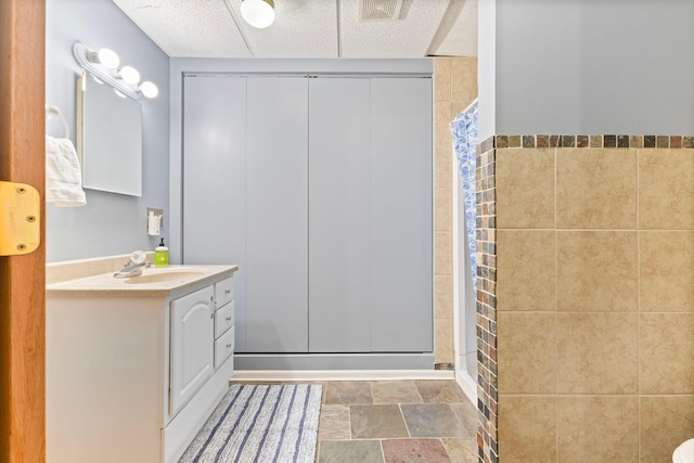 1680 Bluebird Ln, Mound, MN 55364 - full bath featuring vanity, a shower, and stone finish floors