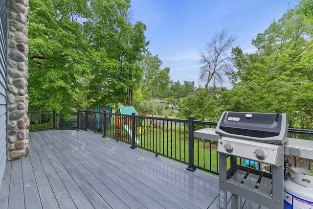 1680 Bluebird Ln, Mound, MN 55364 - deck featuring a playground, area for grilling, and view of scattered trees