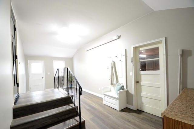 415 Hubbard Ave N, Litchfield, MN 55355 - staircase with vaulted ceiling, wood finished floors, and baseboards