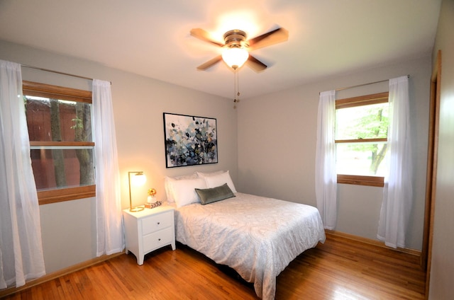 415 Hubbard Ave N, Litchfield, MN 55355 - bedroom with light wood-style floors and ceiling fan