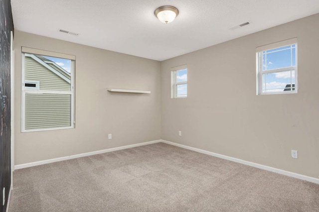 5010 Sandpebble Ln, Woodbury, MN 55129 - carpeted spare room featuring baseboards