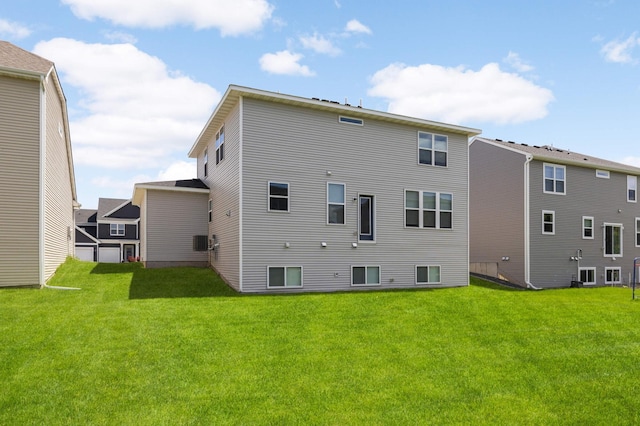 5010 Sandpebble Ln, Woodbury, MN 55129 - rear view of property featuring a lawn