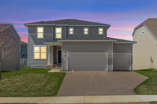 5010 Sandpebble Ln, Woodbury, MN 55129 - traditional-style home with a garage, driveway, and a lawn