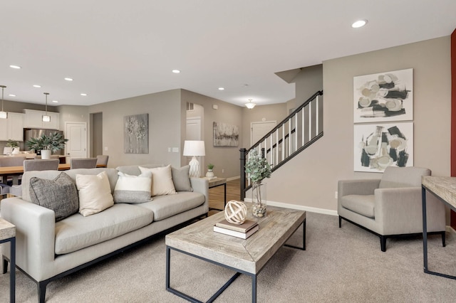 5010 Sandpebble Ln, Woodbury, MN 55129 - living area with recessed lighting, stairs, baseboards, and light carpet