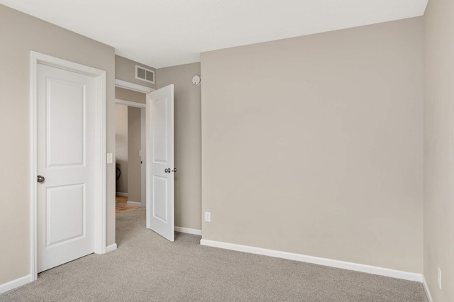 5010 Sandpebble Ln, Woodbury, MN 55129 - unfurnished bedroom with light carpet and baseboards