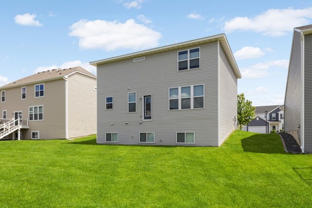 5010 Sandpebble Ln, Woodbury, MN 55129 - back of house with a yard