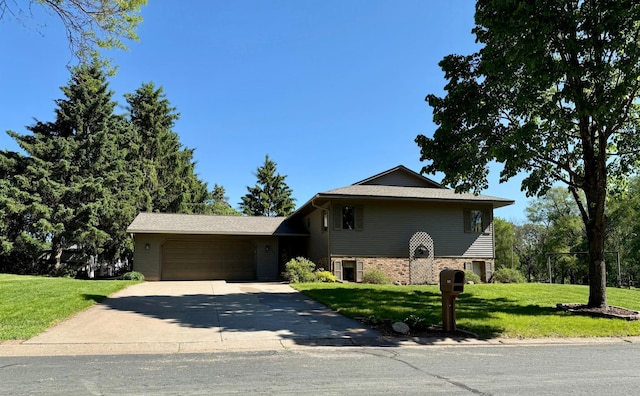507 Pine Ridge Ter, River Falls, WI 54022 - view of front of home with concrete driveway, an attached garage, and a front yard