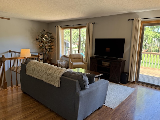 507 Pine Ridge Ter, River Falls, WI 54022 - living room with healthy amount of natural light, wood finished floors, and a textured ceiling