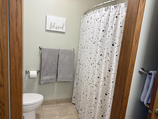 507 Pine Ridge Ter, River Falls, WI 54022 - full bathroom with toilet, a shower with curtain, tile patterned floors, and baseboards