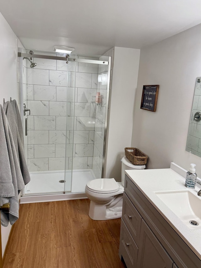 507 Pine Ridge Ter, River Falls, WI 54022 - full bathroom with vanity, toilet, wood finished floors, and a shower stall