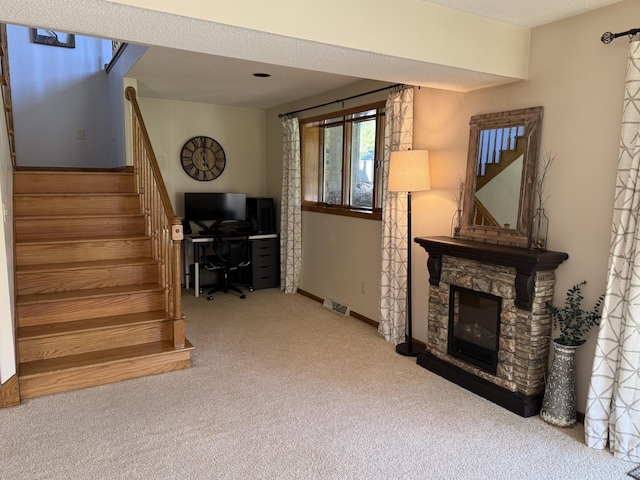 507 Pine Ridge Ter, River Falls, WI 54022 - living area featuring carpet, stairs, a fireplace, baseboards, and a desk