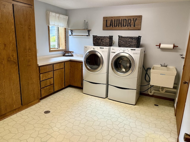507 Pine Ridge Ter, River Falls, WI 54022 - laundry area featuring separate washer and dryer and cabinet space