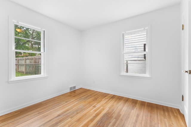 1507 7th Ave NW, Rochester, MN 55901 - spare room featuring light wood-style floors and baseboards
