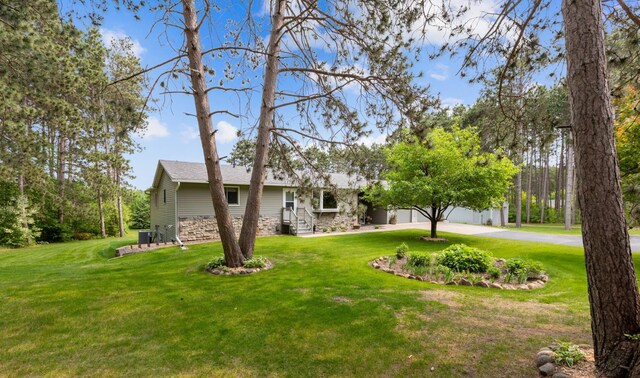 4765 344th Ln NW, Cambridge, MN 55008 - view of front of property featuring a front lawn, curved driveway, and a shingled roof