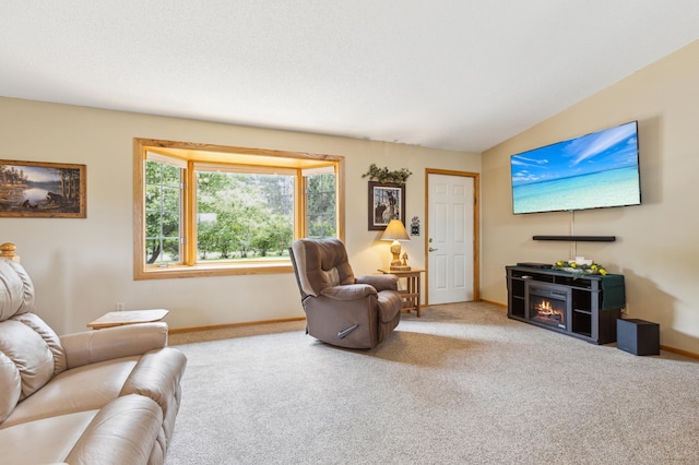 4765 344th Ln NW, Cambridge, MN 55008 - living area featuring carpet flooring, baseboards, and a lit fireplace